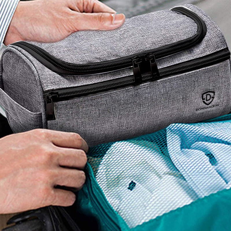 Grey colored, hanging, waterproof toiletry bag with external and internal pockets.