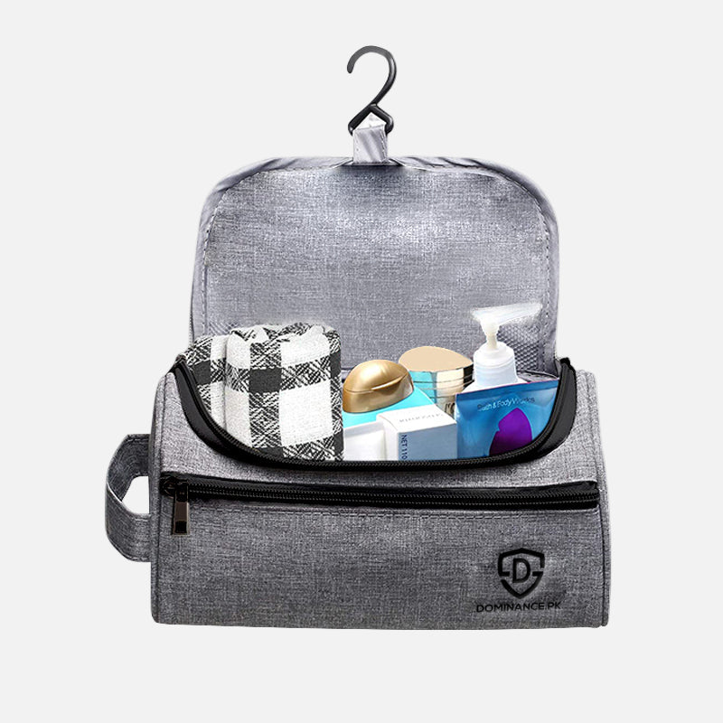 Grey colored, hanging, waterproof toiletry bag with external and internal pockets.